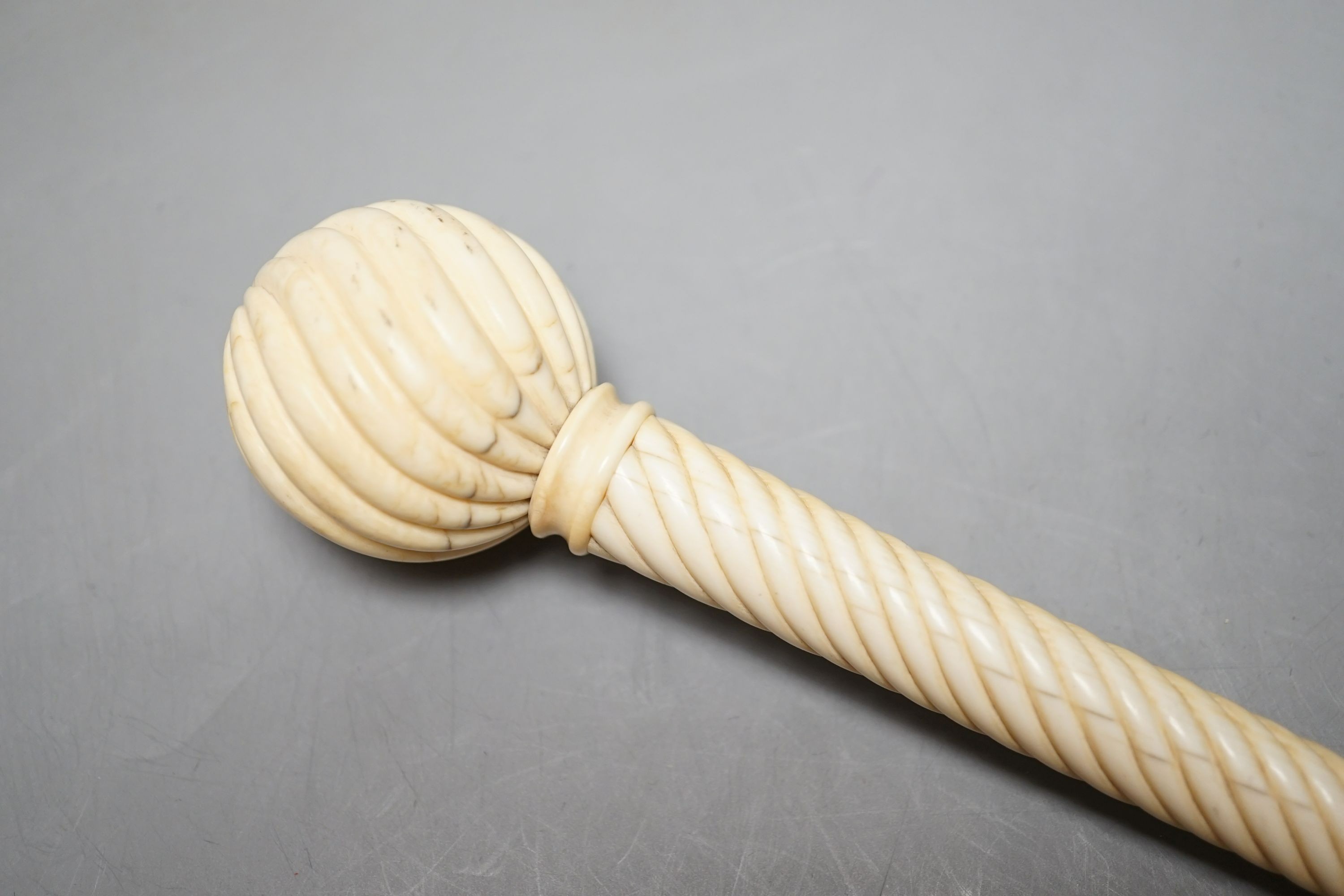 A 19th century Ivory parasol handle, 17 cms long.